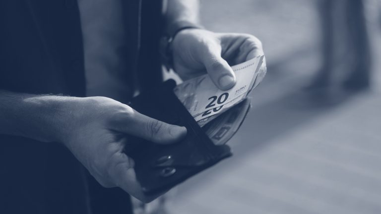 Close-up,View,Of,Hands,Of,Young,Adult,Man,Counting,Money